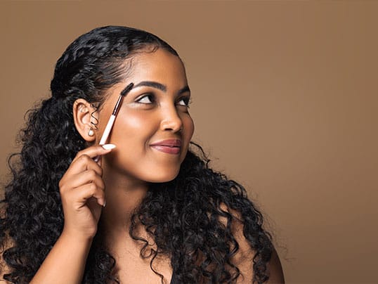 woman after her eyebrow transplant in Miami, FL